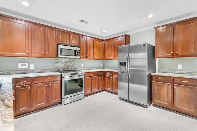 319 Deep River Rd, Summerville, SC 29486 - kitchen with decorative backsplash, light stone counters, stainless steel appliances, and light carpet