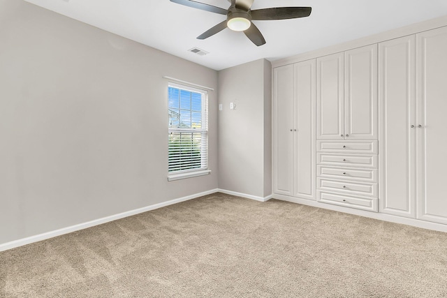 319 Deep River Rd, Summerville, SC 29486 - unfurnished bedroom featuring ceiling fan, light colored carpet, and a closet