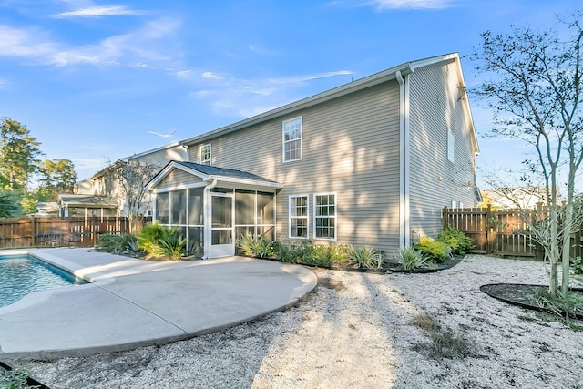 319 Deep River Rd, Summerville, SC 29486 - back of property featuring a fenced in pool, a patio area, and a sunroom