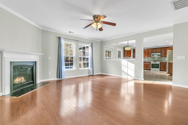 319 Deep River Rd, Summerville, SC 29486 - unfurnished living room with ceiling fan, light hardwood / wood-style floors, and crown molding