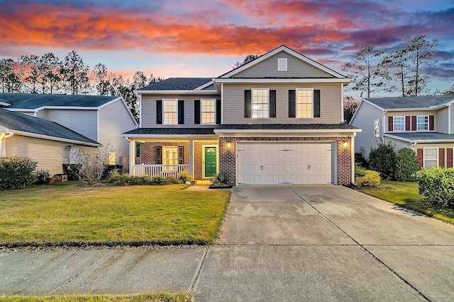 319 Deep River Rd, Summerville, SC 29486 - front of property with covered porch, a yard, and a garage