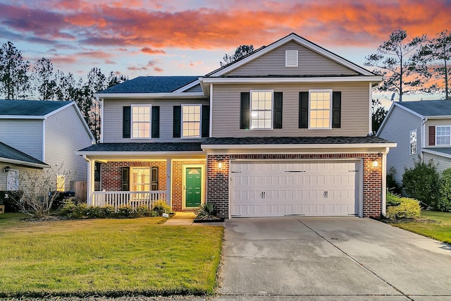 319 Deep River Rd, Summerville, SC 29486 - view of property with a porch, a garage, and a yard