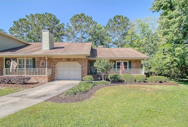 view of front facade with covered porch, brick siding, a chimney, and a front lawn