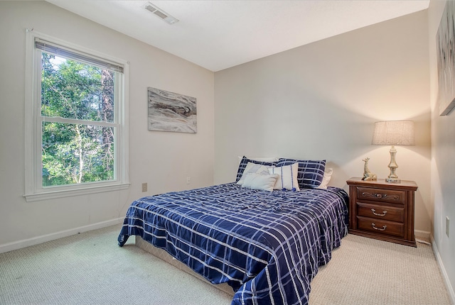 carpeted bedroom with baseboards