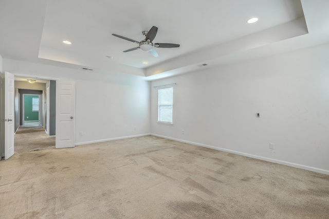 1350 Wild Goose Trl, Summerville, SC 29483 - spare room featuring a tray ceiling, ceiling fan, light carpet, and recessed lighting