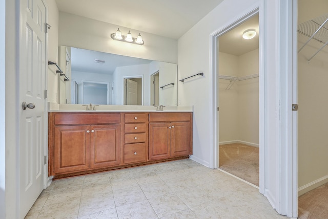 1350 Wild Goose Trl, Summerville, SC 29483 - bathroom featuring double vanity, a spacious closet, and tile patterned floors