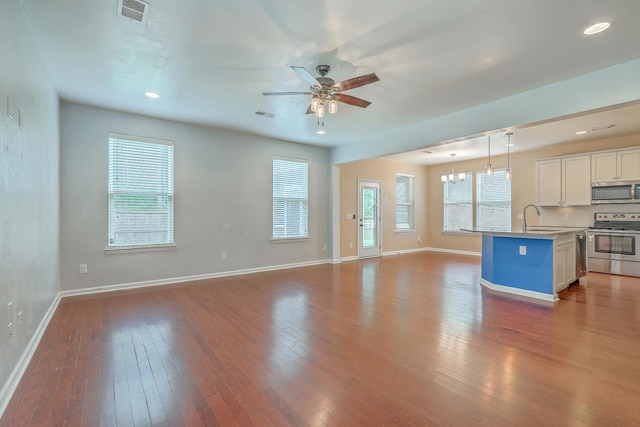 1350 Wild Goose Trl, Summerville, SC 29483 - unfurnished living room with a ceiling fan, wood-type flooring, recessed lighting, and a chandelier
