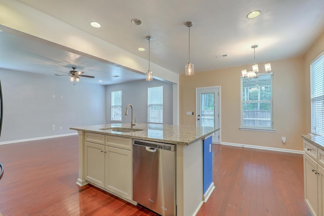 1350 Wild Goose Trl, Summerville, SC 29483 - kitchen with stainless steel dishwasher, dark wood finished floors, light stone countertops, ceiling fan, and a chandelier