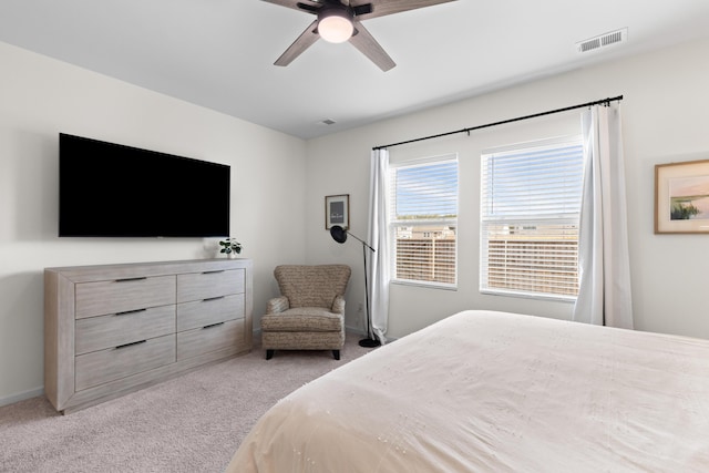 bedroom featuring ceiling fan and light carpet