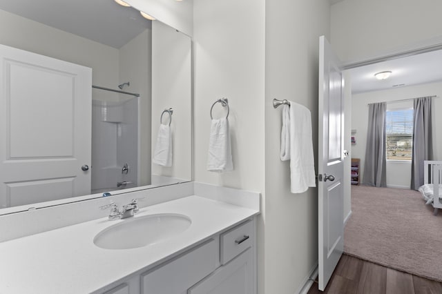 bathroom featuring vanity and wood-type flooring