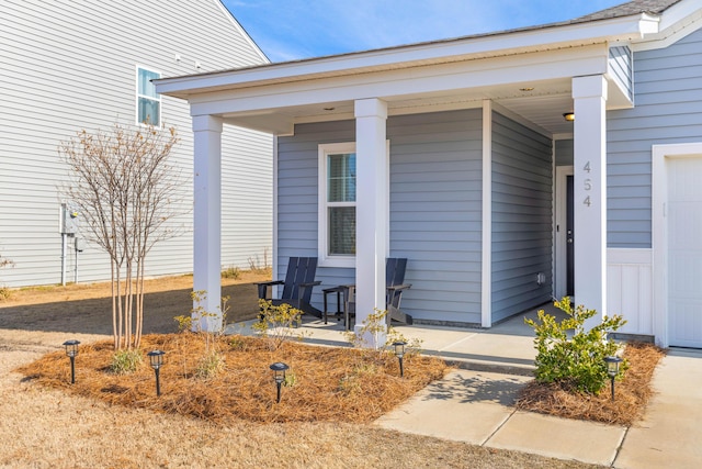 entrance to property featuring a porch