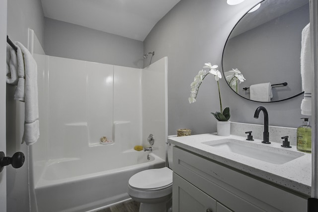 full bathroom with toilet, vanity, and shower / bathtub combination