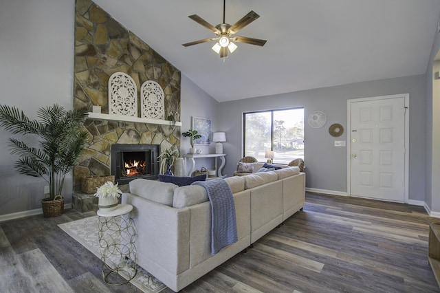 living room featuring dark wood-type flooring, a fireplace, high vaulted ceiling, and ceiling fan