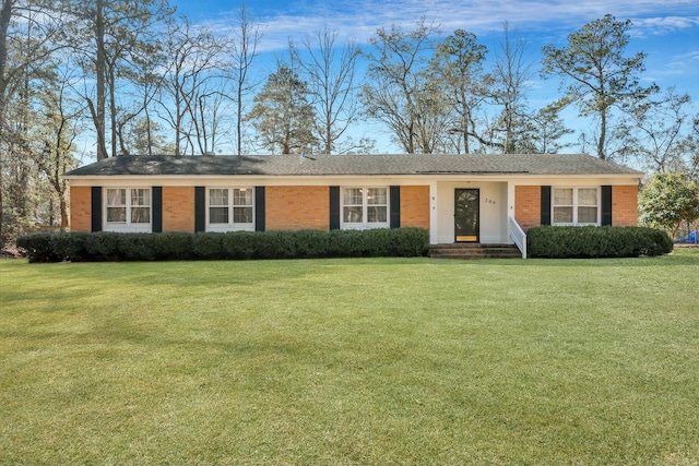 ranch-style home with a front lawn