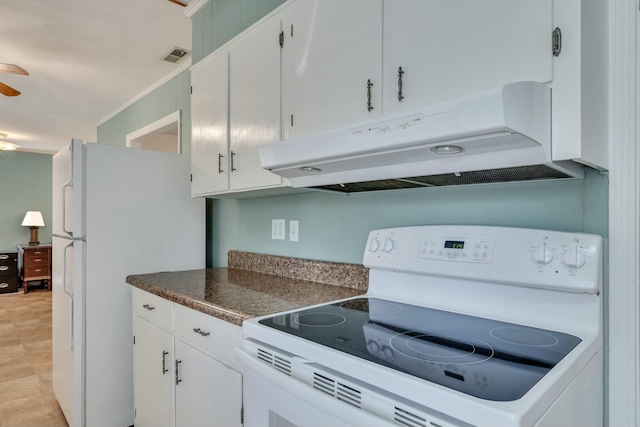 kitchen with white cabinetry and white appliances