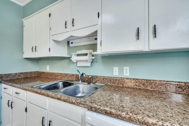 kitchen with sink, white cabinets, and crown molding