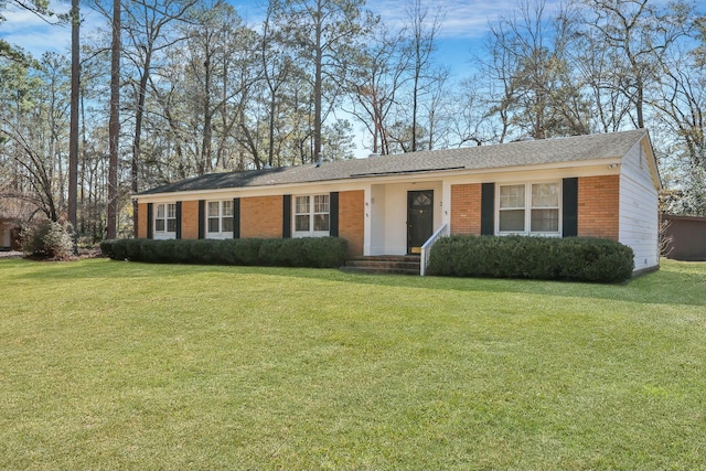 single story home featuring a front lawn