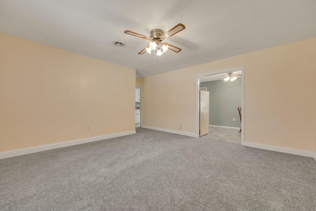 unfurnished room featuring light colored carpet and ceiling fan