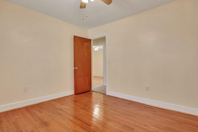 spare room featuring light hardwood / wood-style floors and ceiling fan