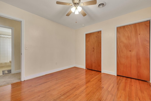 unfurnished bedroom featuring ceiling fan and light hardwood / wood-style floors