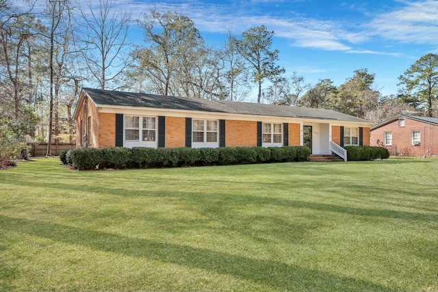 ranch-style house featuring a front lawn