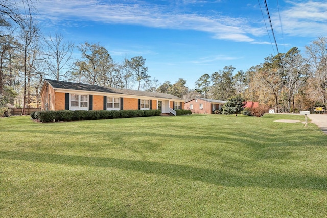 single story home featuring a front yard