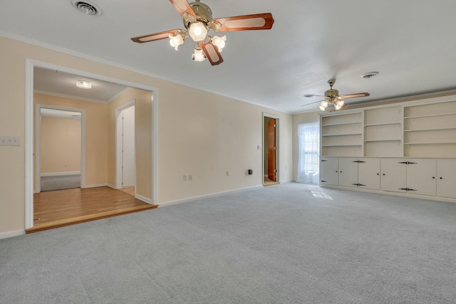 unfurnished living room with ceiling fan, light colored carpet, and ornamental molding