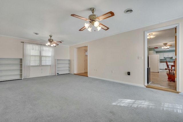 unfurnished living room with ornamental molding and light carpet