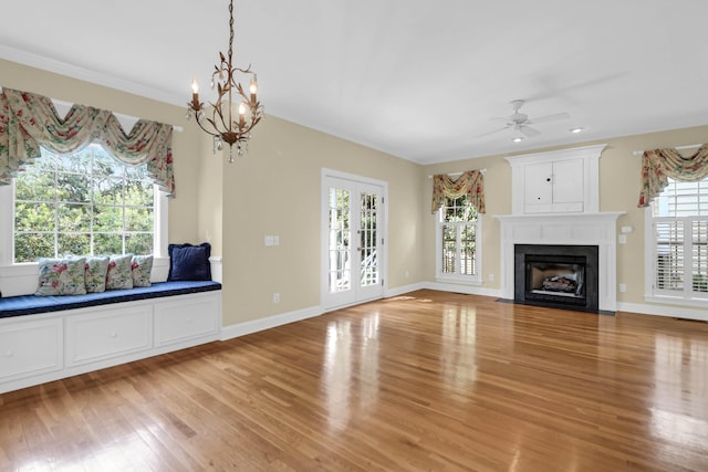 1025 Mathis Ferry Rd, Mount Pleasant, SC 29464 - unfurnished living room with plenty of natural light, light wood finished floors, a fireplace with flush hearth, a ceiling fan, and ornamental molding