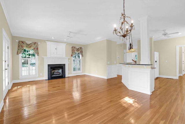 1025 Mathis Ferry Rd, Mount Pleasant, SC 29464 - unfurnished living room with ceiling fan, light wood-style floors, a fireplace with flush hearth, and a chandelier