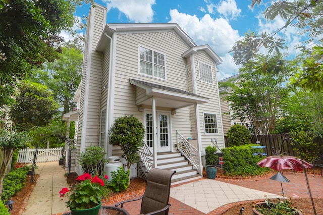 1025 Mathis Ferry Rd, Mount Pleasant, SC 29464 - traditional-style home with a chimney, a patio area, french doors, and entry steps