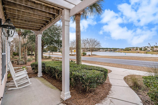 view of patio / terrace with a water view