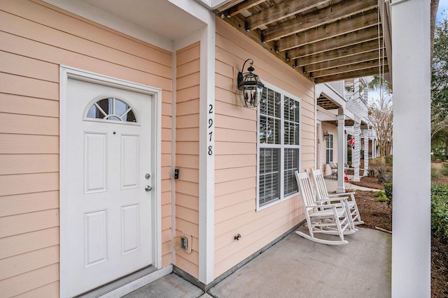 doorway to property with a porch