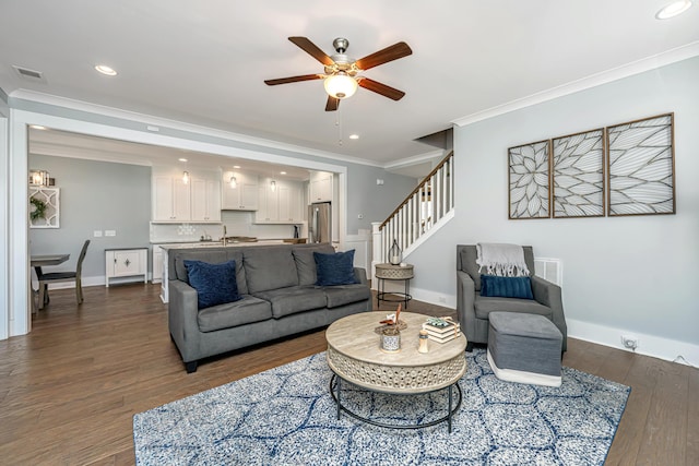 414 Hamlet Cir, Goose Creek, SC 29445 - living area featuring a ceiling fan, crown molding, dark wood finished floors, stairs, and recessed lighting