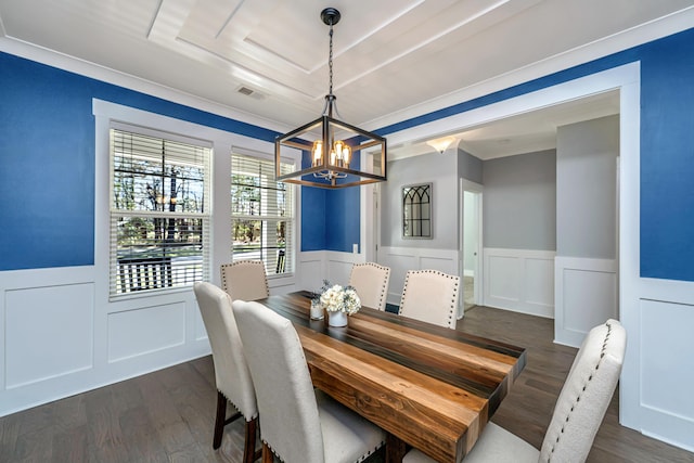 414 Hamlet Cir, Goose Creek, SC 29445 - dining room with wainscoting, a chandelier, a decorative wall, dark wood-style floors, and a raised ceiling