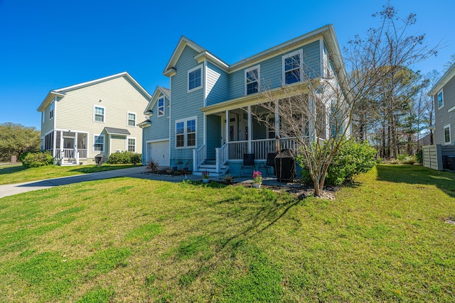 414 Hamlet Cir, Goose Creek, SC 29445 - rear view of property with covered porch, driveway, a lawn, and an attached garage