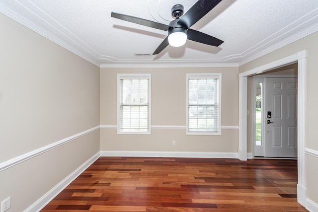 entrance foyer featuring crown molding, a textured ceiling, ceiling fan, and wood finished floors
