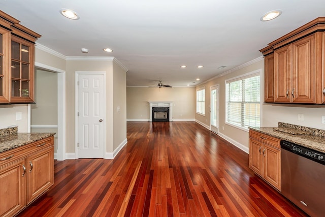 kitchen with crown molding, stainless steel dishwasher, recessed lighting, and light stone countertops