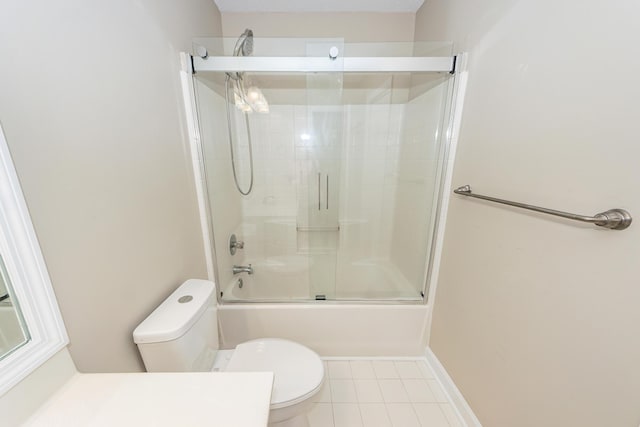 bathroom featuring toilet, tile patterned floors, shower / bath combination with glass door, and vanity
