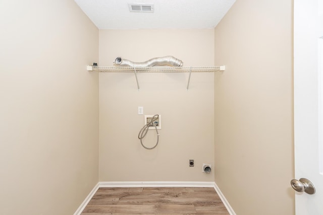 washroom featuring laundry area, washer hookup, light wood-style flooring, hookup for an electric dryer, and visible vents