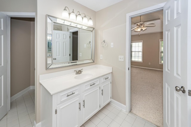 bathroom featuring a ceiling fan, baseboards, and tile patterned flooring