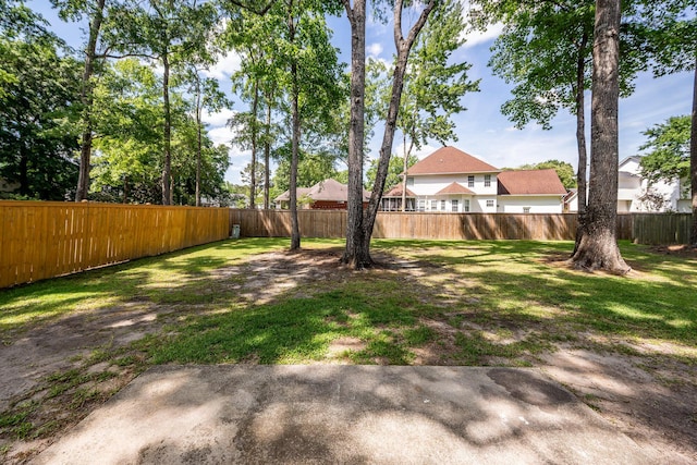view of yard with a fenced backyard