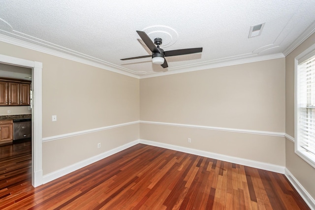 spare room with ceiling fan, a textured ceiling, and dark wood-type flooring