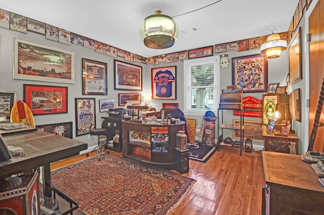 office space with wood-type flooring