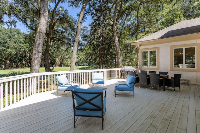 wooden terrace featuring outdoor lounge area