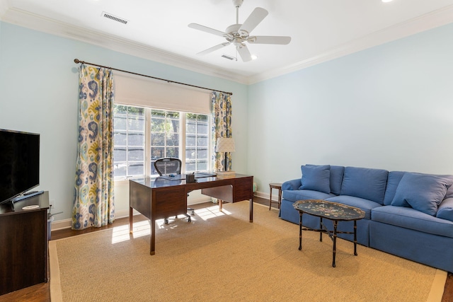 office space with wood-type flooring, ornamental molding, and ceiling fan