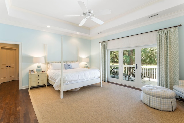 bedroom featuring a raised ceiling, access to exterior, ceiling fan, ornamental molding, and dark hardwood / wood-style floors