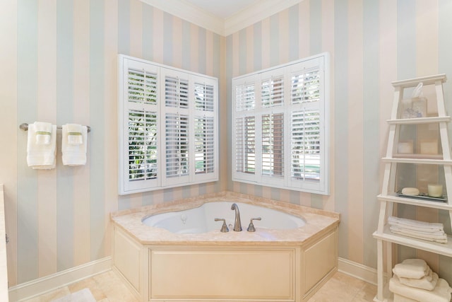 bathroom featuring a bathtub, ornamental molding, and a healthy amount of sunlight