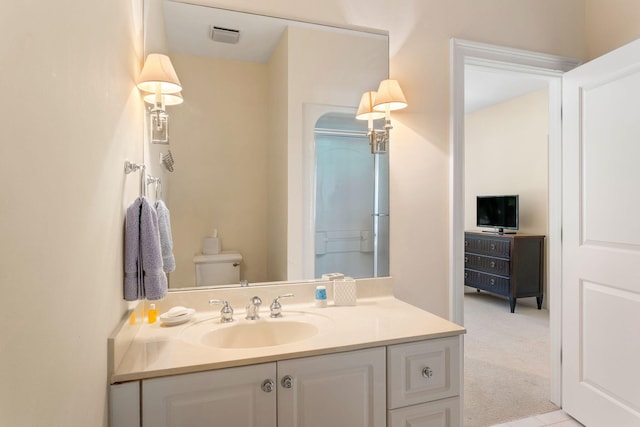 bathroom with vanity and toilet