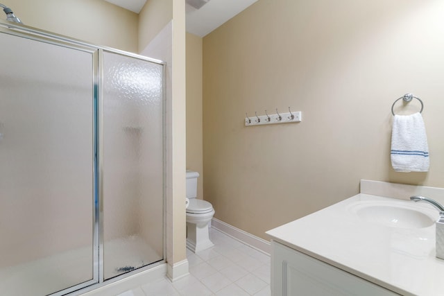 bathroom featuring vanity, toilet, an enclosed shower, and tile patterned floors